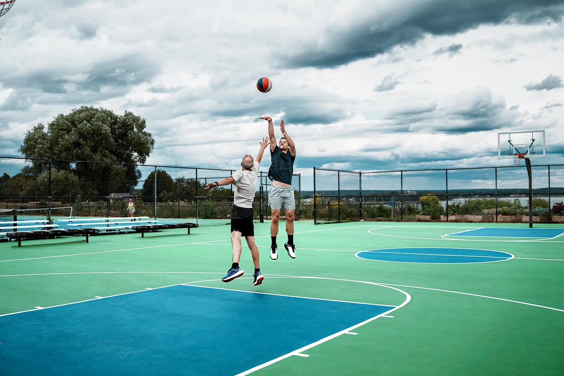 New outdoor basketball court at sunset